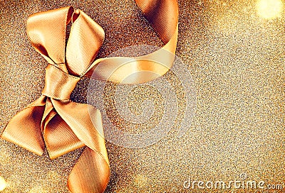 Christmas golden satin ribbon bow Stock Photo