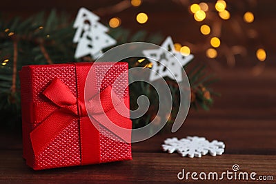 Christmas greeting caed with gift box, Christmas decorations, Christmas tree branches, and bokeh. Close-up, selective Stock Photo