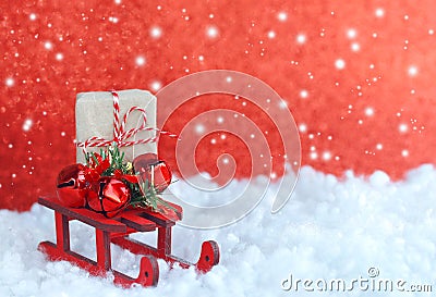 Christmas greeting card, toy wooden sleigh, decorative bells, gi Stock Photo