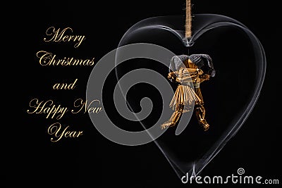 Christmas greeting with dancing straw dolls in a heart Stock Photo