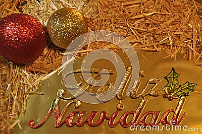 Christmas gretting card. Feliz Navidad. Latin spanish Merry Christmas message with nativity decoraton Stock Photo