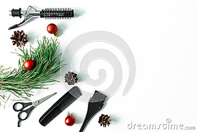 Christmas hairdresser accessories with combs, brush, scissors, tools with new year decorations on white background Stock Photo