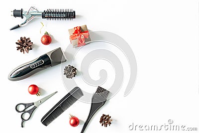 Christmas hairdresser composition with gift box. combs, brush, scissors, tools and accessories with new year decorations Stock Photo