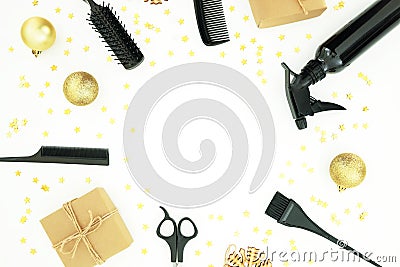 Christmas hairdresser frame composition with spray, combs, scissors and gift box with balls on white background. Flat lay, top vie Stock Photo