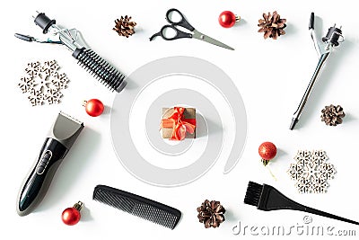 Christmas hairdresser frame with present box, combs, brush, scissors, tools and accessories with new year decorations on Stock Photo