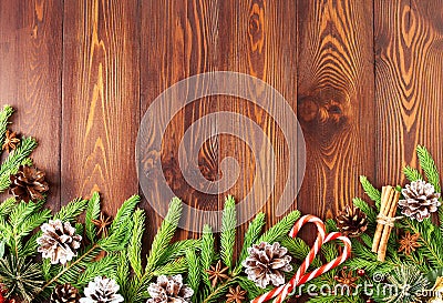 Christmas and Happy New Year dark brown background. Top view, copy space, wooden rustic table, fir branches Stock Photo