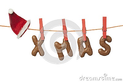 Christmas hat and Xmas letters hanging on washing line, isolated on white background Stock Photo