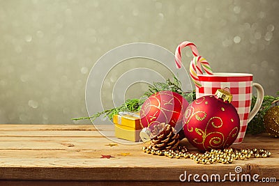 Christmas holiday background with checked cup and decorations over blur dreamy background Stock Photo