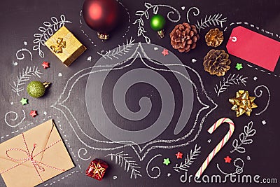 Christmas holiday background with decorations and hand drawings on chalkboard. View from above Stock Photo