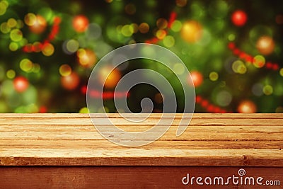 Christmas holiday background with empty wooden deck table over festive bokeh. Ready for product montage Stock Photo