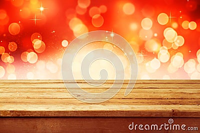 Christmas holiday background with empty wooden deck table over festive bokeh. Ready for product montage Stock Photo