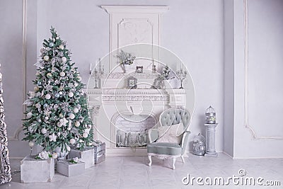 Christmas holiday background. Christmas tree with silver and white decoration. Beautiful Christmas tree closeup Stock Photo