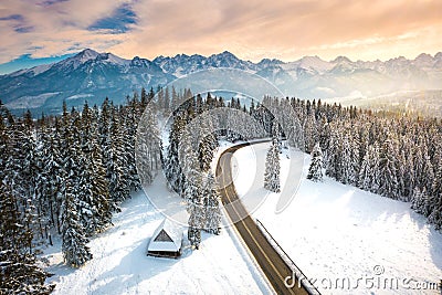 Christmas holiday background. Winter Mountain landscape. House, forest and mountains Stock Photo