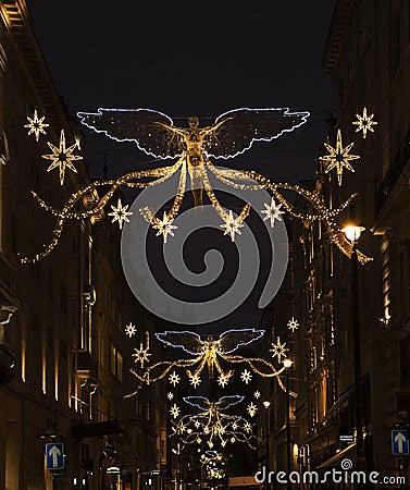 Christmas holiday season lighting above a shopping street. 1 Stock Photo