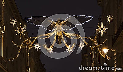 Christmas holiday season lighting above a shopping street. 2 Stock Photo