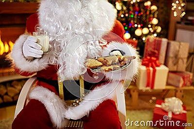 Christmas, holidays, food, drink and people concept - of Santa C Stock Photo