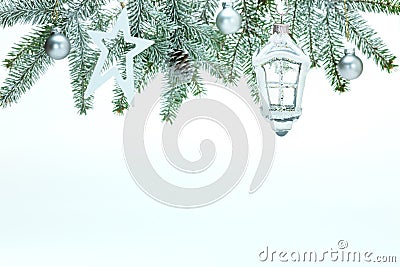 Christmas background with fir tree branch, decorative glass lantern, stars, balls and pine cone Stock Photo