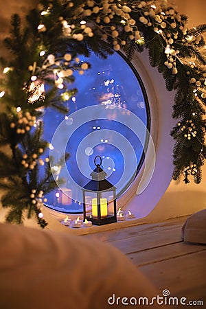 Christmas home decor. Atmospheric indoor photo with old vintage glowing lantern Stock Photo