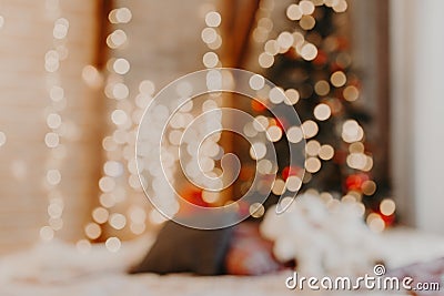 Christmas home room with tree and festive bokeh lighting, blurred holiday background Stock Photo