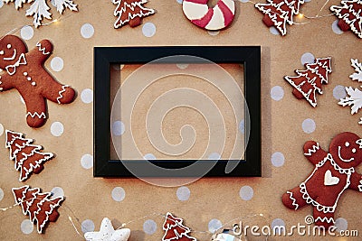 Christmas homemade gingerbread cookies with mock up frame. Homemade baking cookies. Festive aesthetic card. Christmas Stock Photo