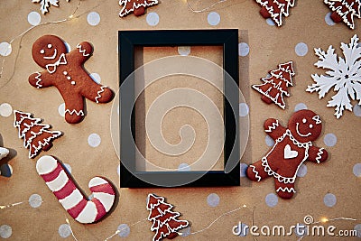 Christmas homemade gingerbread cookies with mock up frame. Homemade baking cookies. Festive aesthetic card. Christmas Stock Photo