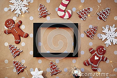 Christmas homemade gingerbread cookies with mock up frame. Homemade baking cookies. Festive aesthetic card. Christmas Stock Photo