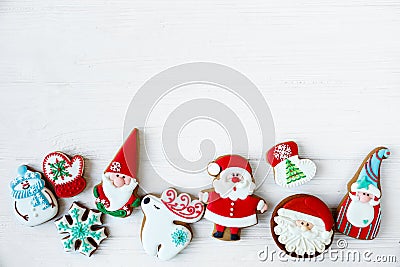 Christmas homemade gingerbread man and christmas tree cookies on white wooden background Traditional cookies with icing Stock Photo