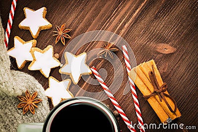 Christmas hot steaming cup of glint wine with spices, cinnamon, anise, cookies in a shape of star, red candies, pepper and gray Stock Photo