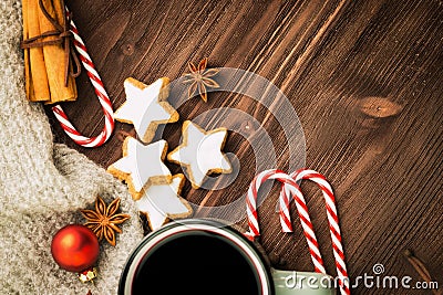 Christmas hot steaming cup of glint wine with spices, cinnamon, anise, cookies in a shape of star, red candies, pepper and gray Stock Photo