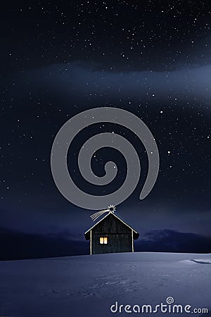 Christmas Illuminated hut in cold winternight Stock Photo