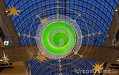 Christmas installation in the mall in the shape of a glowing green emerald. Stock Photo