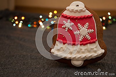 Christmas jingle bell gingerbread on garland background Stock Photo