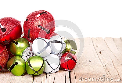 Christmas jingle bells on a plank Stock Photo