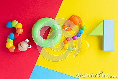 2021 Christmas kids. Numbers from rainbow construction blocks and toys on a bright colorful background. Children\'s colorful Stock Photo