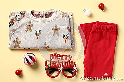 Christmas kids outfit. Toddlers pajama set on color background. Baby fashion holiday wear Stock Photo