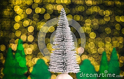 Christmas landscape with fir tree, forest and warm white lights in the background Stock Photo