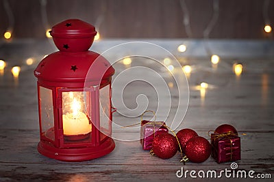 Christmas lantern with candle and small christmas decoration Stock Photo