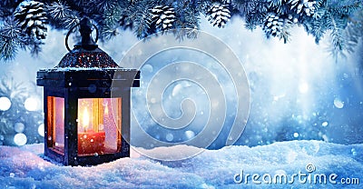 Christmas Lantern On Snow With Fir Branch Stock Photo