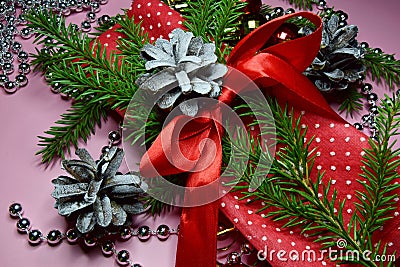 Christmas layout red napkin in white polka dots with a branch of the Christmas tree tied with a red ribbon. Stock Photo