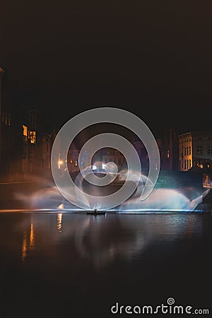 Christmas light show in the form of the Swan Dance on the water canal in the historic district in Bruges, Belgium. Romantic scene Stock Photo