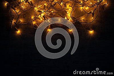 Christmas lights background concept on wooden desk. Stock Photo