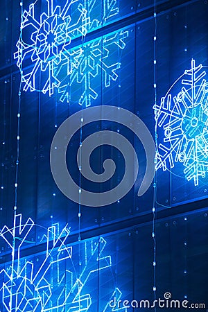 Christmas lights decoration on a building facade in blue tone Stock Photo