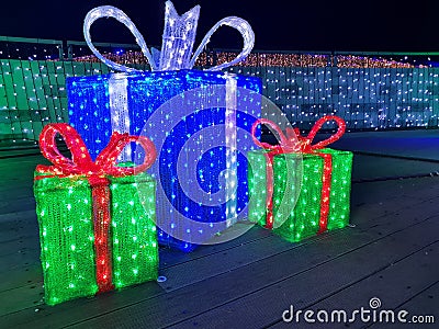 Christmas lights gift box, illuminated presents at night Stock Photo