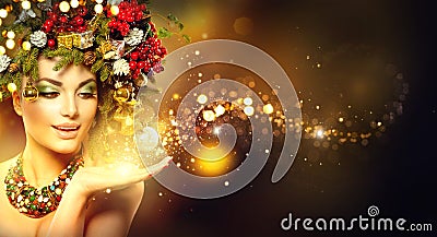 Christmas magic. Beauty model over holiday blurred background Stock Photo