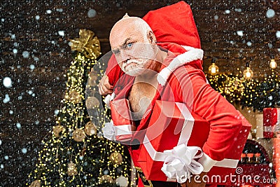 Christmas man in snow. Thief Santa with bag on christmas background. Thief stole new years presents. Christmas safety Stock Photo