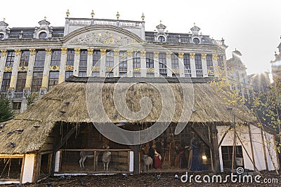 Christmas Manger at brussels famous christmas market with an antique building at background Editorial Stock Photo