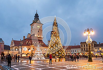 Christmas market and decorations tree on center of Brasov town, Transylvania, Romania Editorial Stock Photo