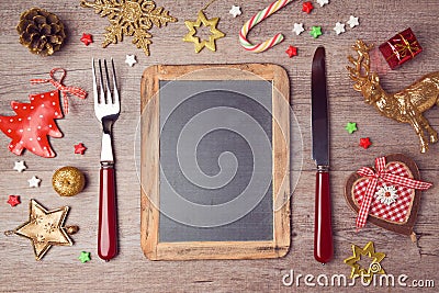 Christmas menu background with chalkboard and decorations. View from above Stock Photo