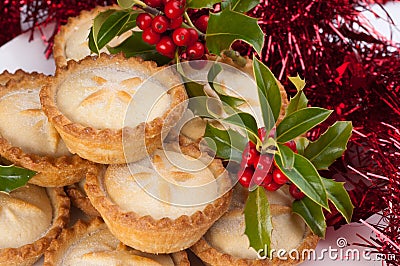 Christmas Mince Pies with Holly and Decorations Stock Photo