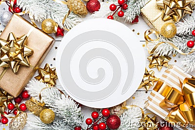 Christmas mockup with gifts or presents boxes, snowy fir tree and holiday decorations on white wooden table top view. Flat lay. Stock Photo